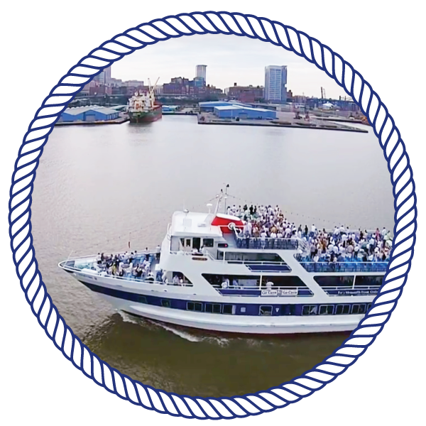 overhead view of the goodtimeiii boat, with passengers, cruising down the river