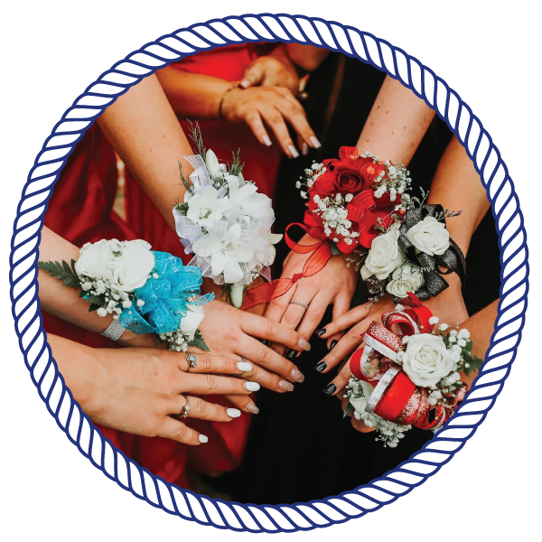 bridesmaids, holding their hands close to each other, with flowers attached